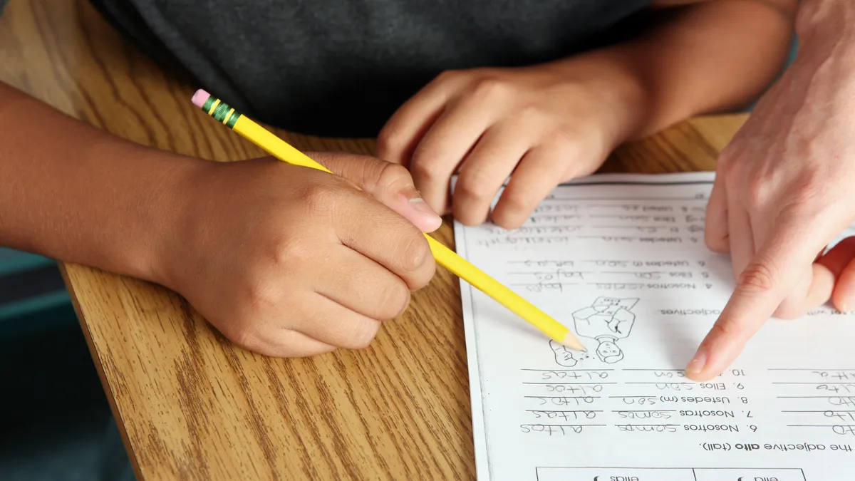 Child working on reading exercises with a specialist